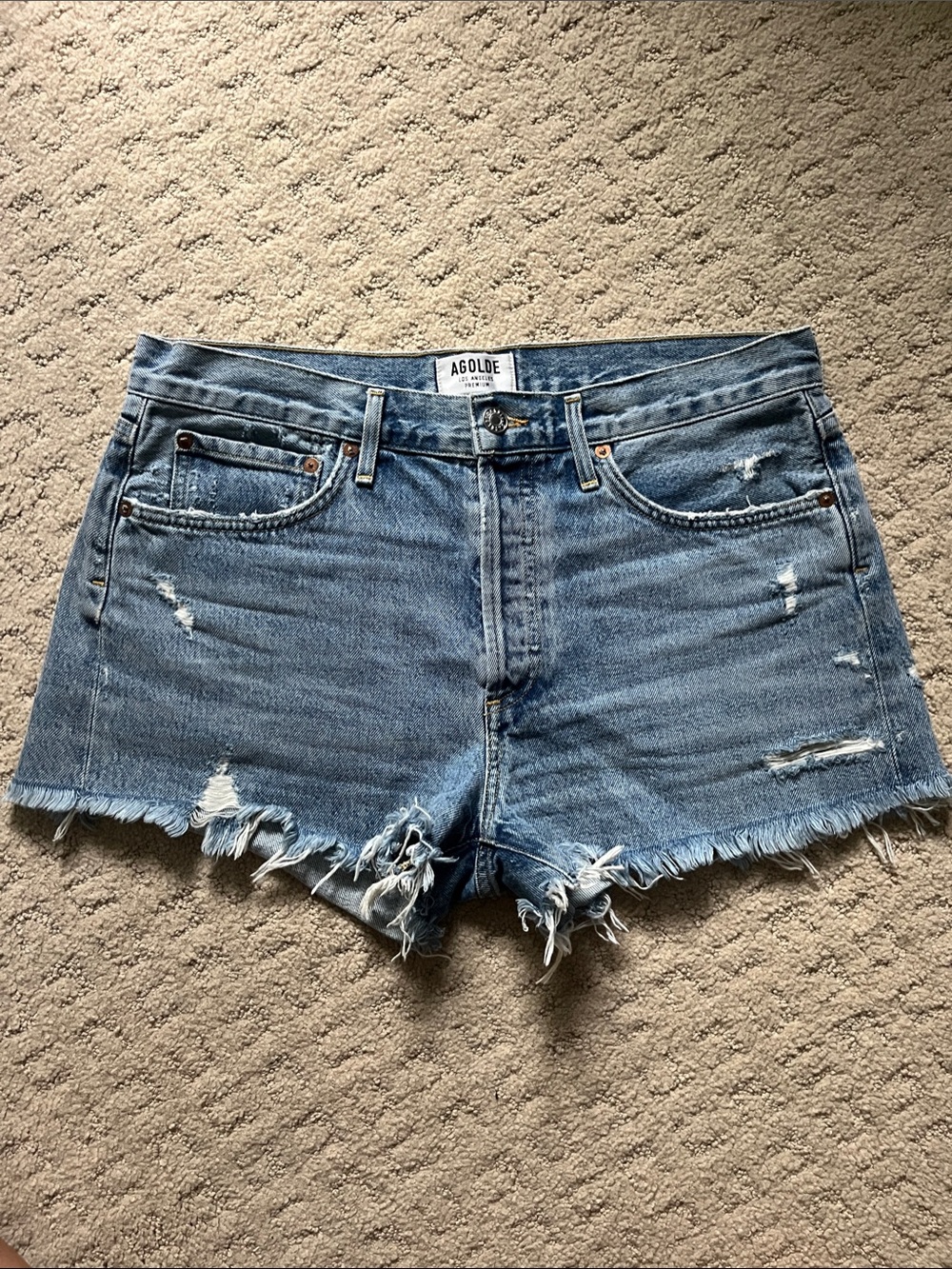 Agolde Mid-Rise Distressed Denim Cutoff Shorts in Light Blue